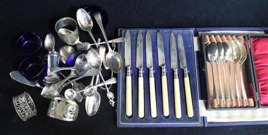Two silver caddy spoons including Georgian and other assorted items including silver spoons an napkin rings.